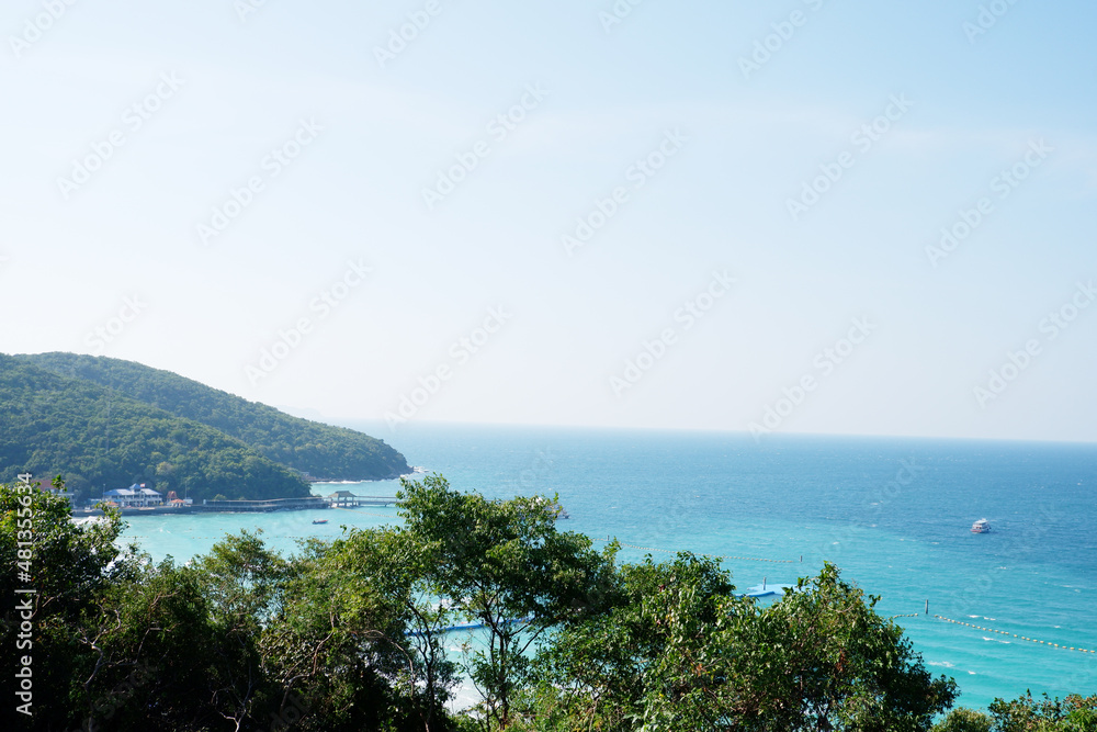 View of the sea, clear blue water and mountains.