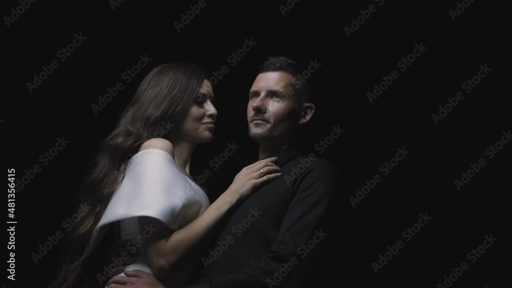 beautiful couple in love at the fireworks in the evening beautiful couple in love at the fireworks in the evening