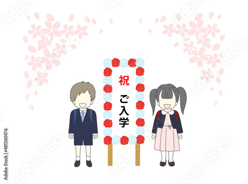 桜吹雪の入学式　看板の横に立つ男女の新1年生　紅白　花　看板