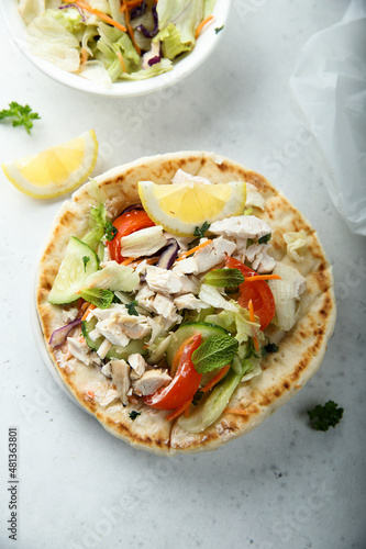Fresh Greek pita bread with chicken and vegetables