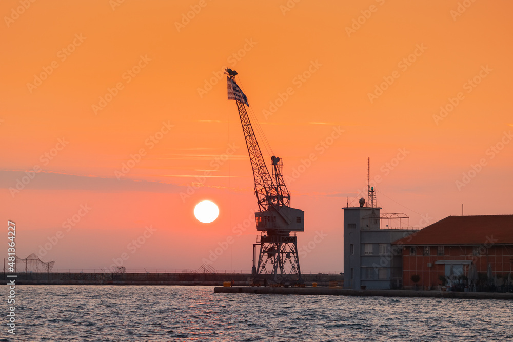Sunset view of sea port of Thessaloniki city. Marina and cargo transport in Macedonia concept