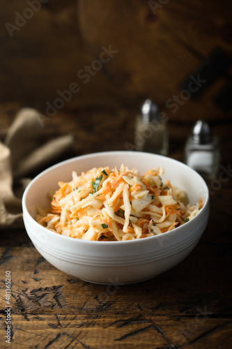 Traditional homemade coleslaw salad with fresh parsley