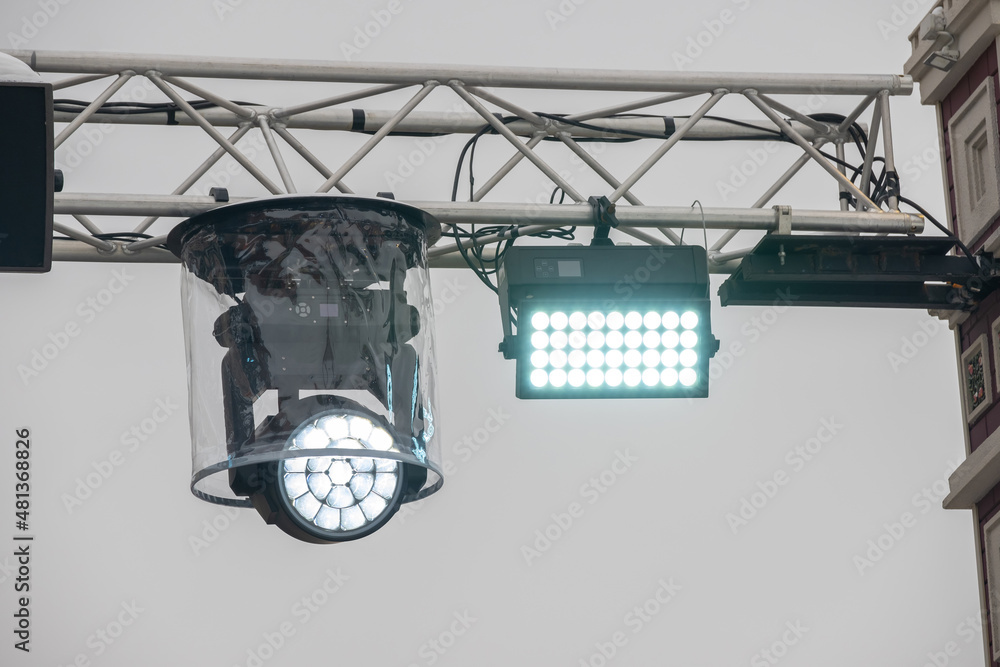 Stage lighting rig with moving head for event and concert stage. Night