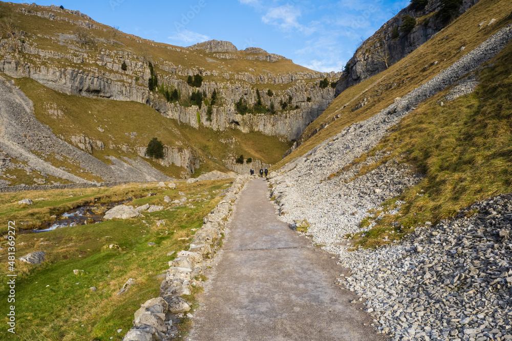 Walkers on their way to Gordale Scar near Malham in the Yorkshire Dales