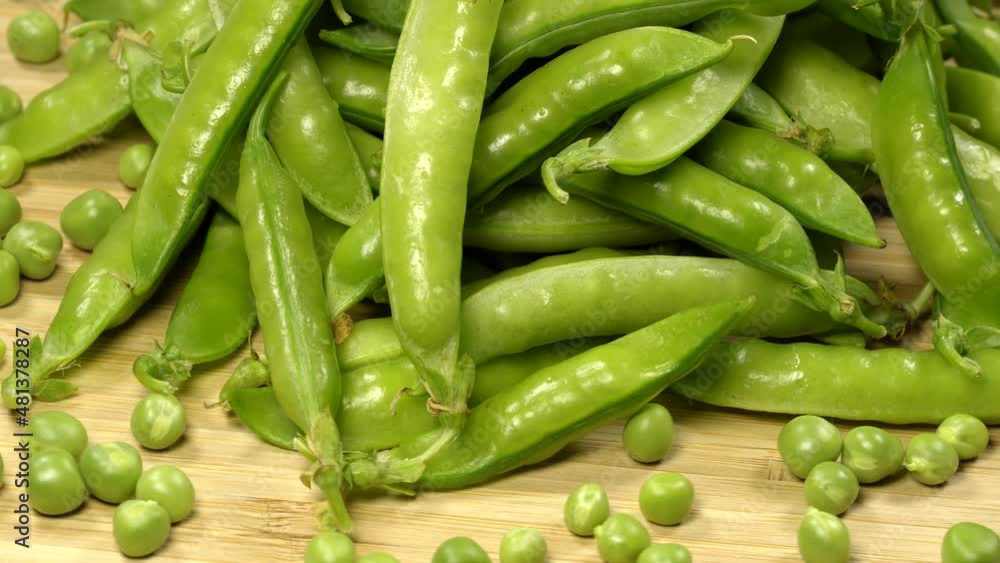 Fresh green peas pods rotation close up. Loop motion Fresh green peas pods rotation close up. Loop motion