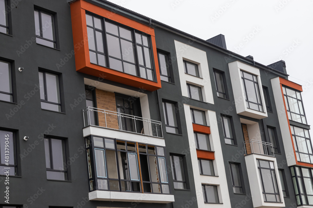 Fragment of Modern residential apartment with flat buildings exterior. Detail of New luxury house and home complex. Part of City Real estate property and condo architecture. Copy space Fragment of Modern residential apartment with flat buildings exterior. Detail of New luxury house and home complex. Part of City Real estate property and condo architecture. Copy space