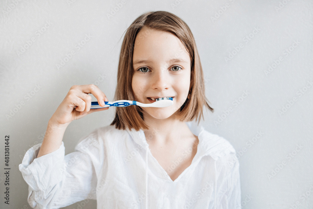 Girl brushes her teeth, dental care since childhood, a visit to the dentist Girl brushes her teeth, dental care since childhood, a visit to the dentist
