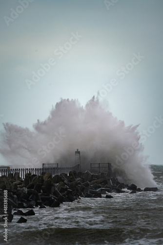 Beach of norre vorupor, denmark, stormy day and the waves break over the pier