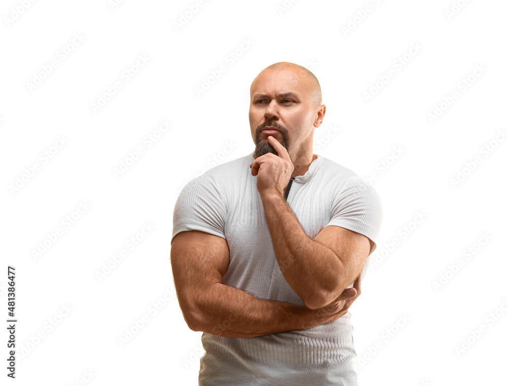 Thoughtful brutal man 40 years old looking at camera - photo on a white background. Thoughtful brutal man 40 years old looking at camera - photo on a white background.
