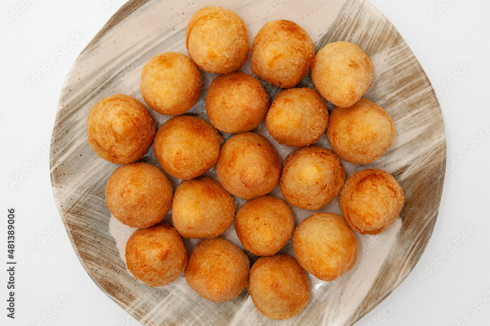 Typical Brazilian appetizer called Coxinha de Frango isolated on white background - Top view Typical Brazilian appetizer called Coxinha de Frango isolated on white background - Top view