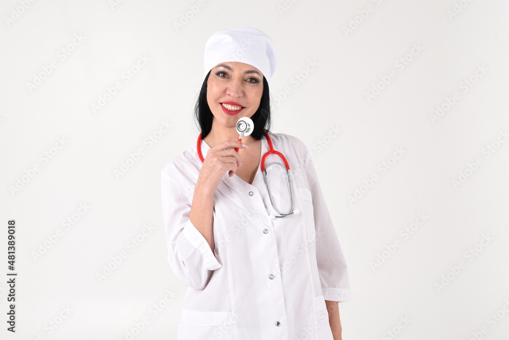 A female therapist with a stethoscope in the clinic on a white background A female therapist with a stethoscope in the clinic on a white background