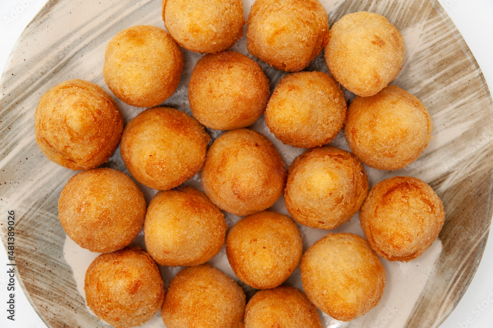 Typical Brazilian appetizer called Coxinha de Frango isolated on white background - Top view. Close-up Typical Brazilian appetizer called Coxinha de Frango isolated on white background - Top view. Close-up
