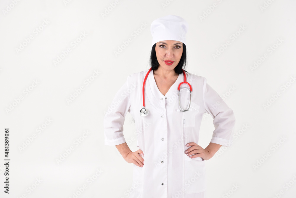 A female therapist with a stethoscope in the clinic on a white background A female therapist with a stethoscope in the clinic on a white background