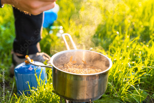 Camping food on gas stove. Ramen in camping stove