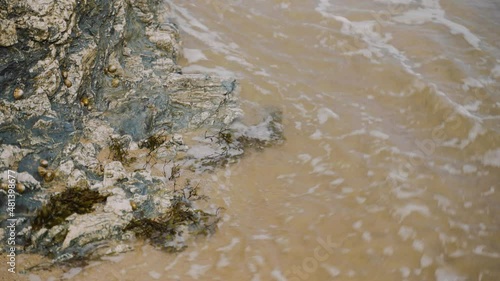 tide flowing onto sand