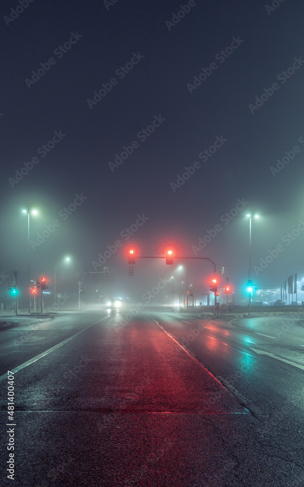 empty city street in foggy night