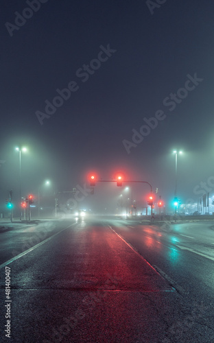 empty city street in foggy night
