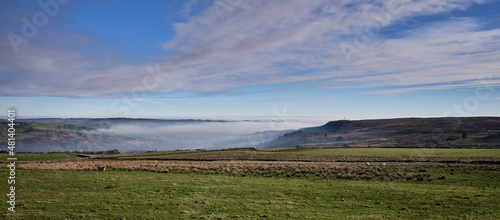 Mist hangs in the bottom of Nidderdalewhile winter sun covers the hill tops © Fencewood studio