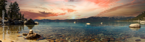 Panoramic mountain landscape scene in Lake Tahoe California with a colorful sunset in the background