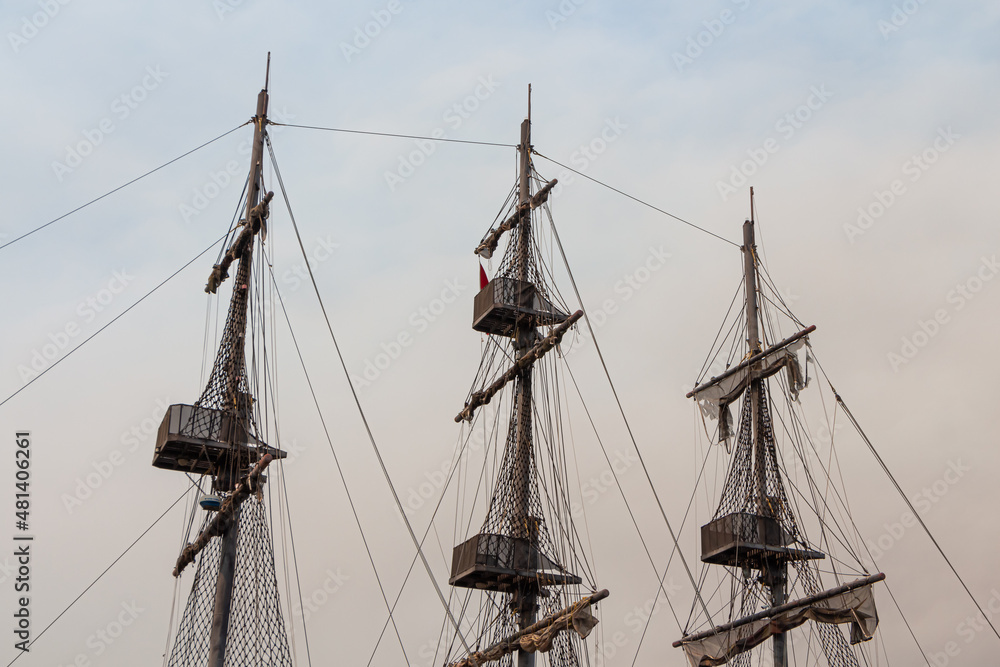 Beautiful masts of a sailing vessel on the blue sky background Beautiful masts of a sailing vessel on the blue sky background