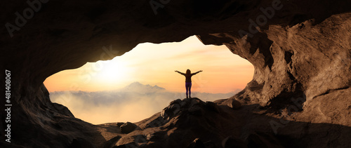 Dramatic Adventurous Scene with Woman standing inside a Rocky Cave Landcspae. 3d Rendering. Sunset Sky. Aerial Mountain Image from British Columbia, Canada. Adventure Concept photo