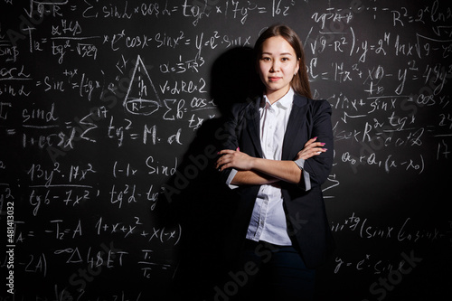 teacher at the Institute stands near a complex example