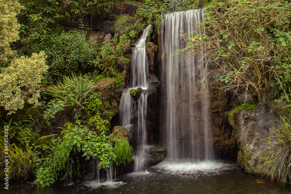 Waterfall in a forest with the water looking like smoke. Waterfall in a forest with the water looking like smoke.