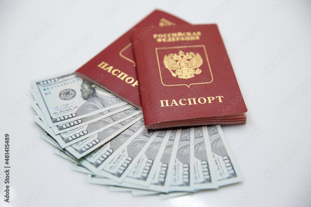two Russian passports and one hundred dollar bills two Russian passports and one hundred dollar bills
