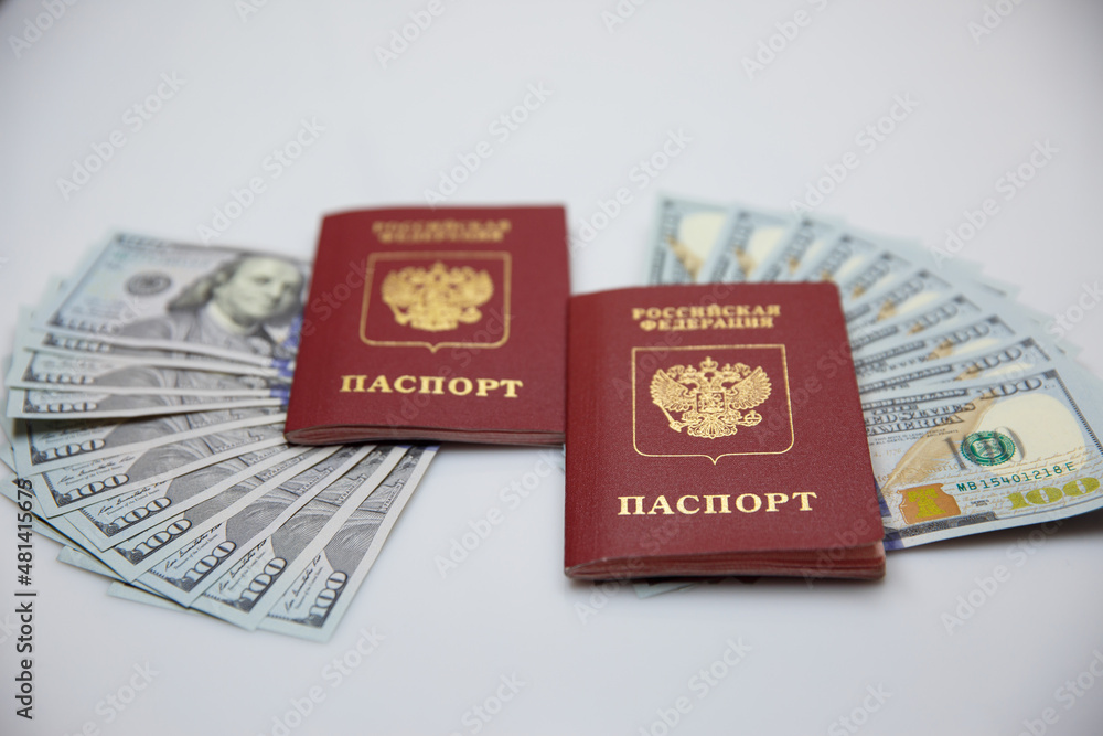 Fototapeta premium two Russian passports and one hundred dollar bills