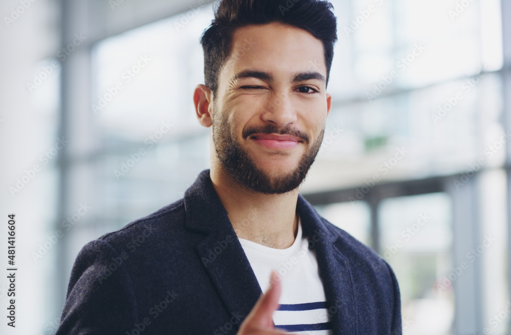 I've got this. Cropped shot of a young businessman showing winking and showing thumbs up while walking through a modern office. I've got this. Cropped shot of a young businessman showing winking and showing thumbs up while walking through a modern office.