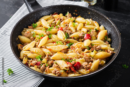 Conchiglie pasta. Italian pasta shells with minced meat, zucchini, tomato and sweet peppers.