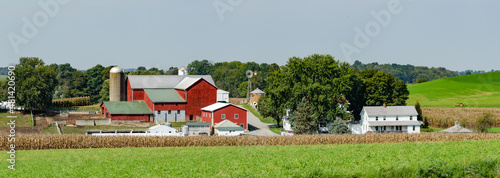 Amish Farm Setting with a Red Barn and Green Fields in Ohio's Amish Country