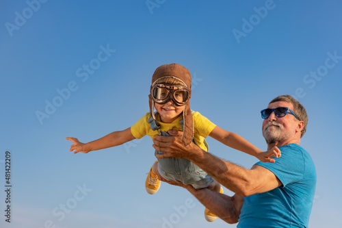 Grandfather and boy having fun outdoor