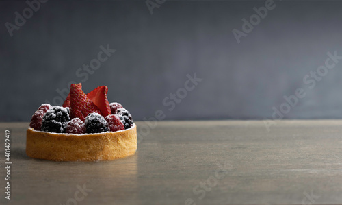Strawberries, raspberries and blackberries  tart  with space for text  