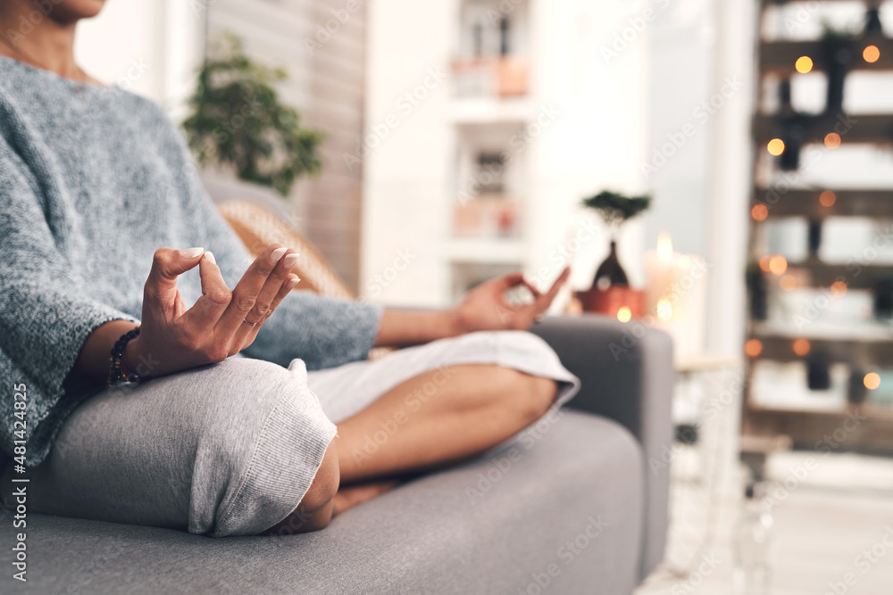 I could sit here all day. Cropped shot of an unrecognizable woman sitting in a lotus position alone and meditating in her living room at home. I could sit here all day. Cropped shot of an unrecognizable woman sitting in a lotus position alone and meditating in her living room at home.