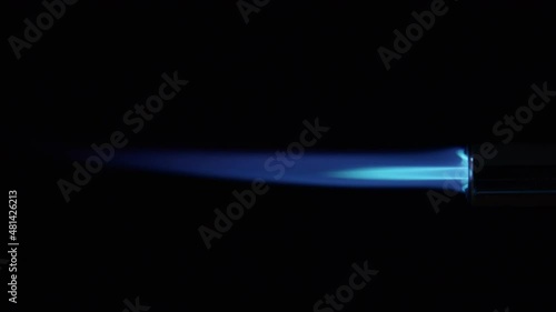 Butane Gas Flame and nozzle against black from a butane torch burner. 50 FPS. Blue and yellow flame. Element for VFX and Compositing, e.g. as rocket propulsion, spaceship drive or welding flame photo