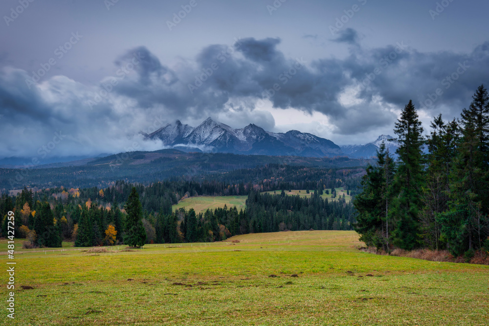 A cloudy sunrise on the meadow under the Tatra Mountains at autumn. Poland A cloudy sunrise on the meadow under the Tatra Mountains at autumn. Poland