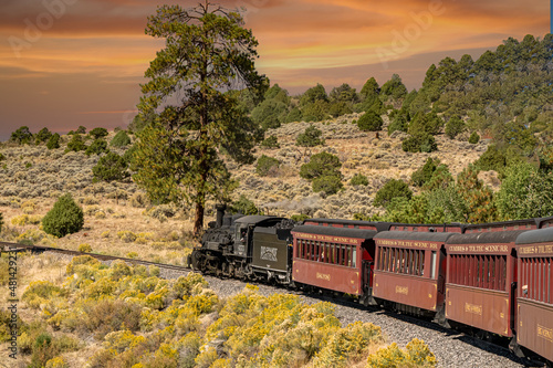 A steam engine locomotive and passenger cars on the Cumbris & Toltec scenic railroad near Antonio colorado photo