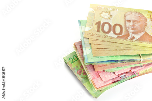 High Angle View of Large Stack of Canadian Banknotes on a White Background