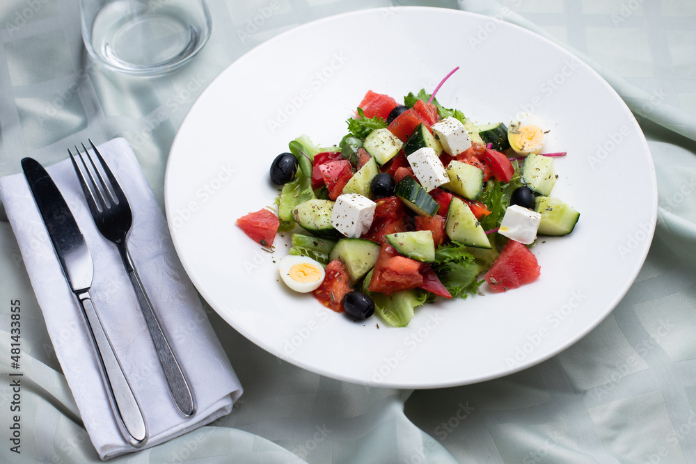 greek salad, greek salad on a white plate