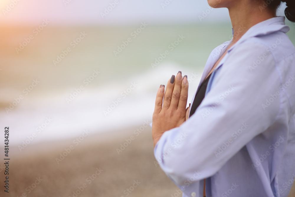 No face portrait of young woman doing yoga or meditating on the seaside. Yoga sport. Healthy wellness lifestyle. Spiritual health. Personal fulfillment. - obrazy, fototapety, plakaty 