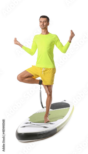 Young man meditating on sup...