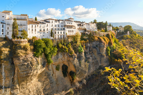 View of the medieval hillside town from one of the cono balconies overlooking the gorge and canyon near the bridge in Ronda, Spain photo