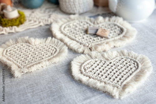 A set of macrame napkins in the form of hearts, made of light cord, handmade photo