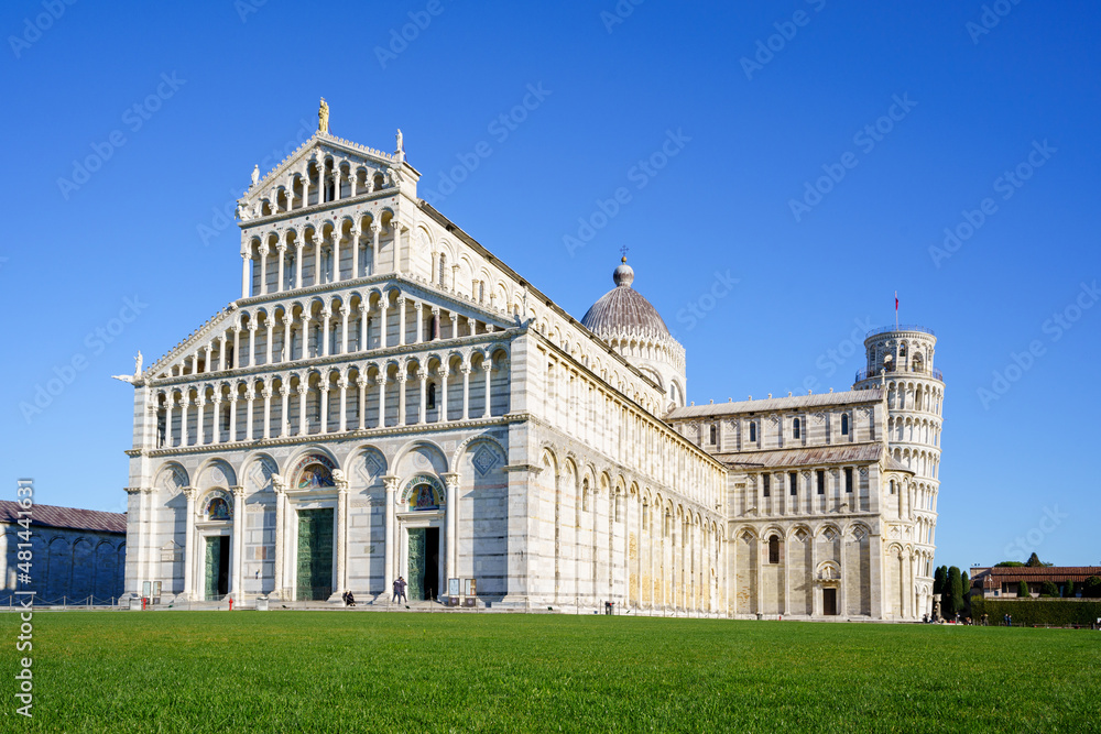 Piazza dei Miracoli - Pisa, Italy, January 2021: Cathedral medieval Roman Catholic Assumption of the Virgin Mary in Piazza dei Miracoli and Pisa leaning tower