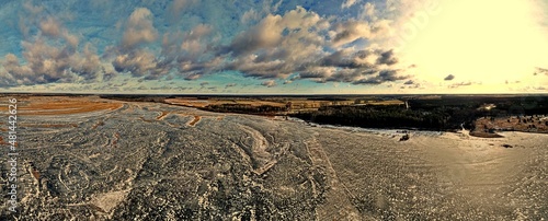 Panorama.View from the top of the backwaters of the Narew river ice-bound in winter.