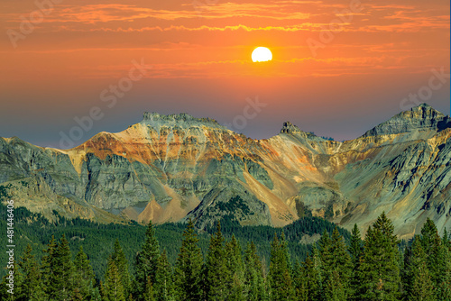 Pine tree forest and the San Juan Mountains near Ouray Colorado photo