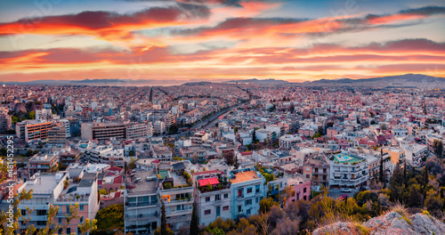 Aerial evening cityscape of Athens. Urban spring scene of Greece, Europe. Splendid sunset in the big sity. Traveling concept background.