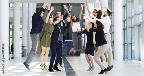 We did it. Full length shot of a group of businesspeople celebrating in the workplace.