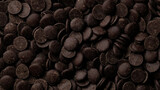 Dark chocolate chips top view. Camera moves away from the object